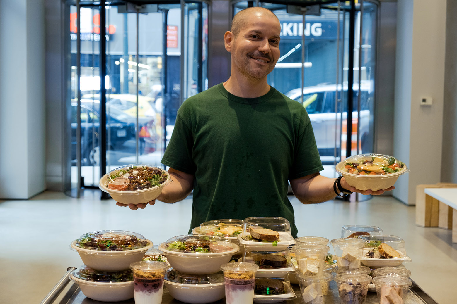A paid lead rescuer holding donated food